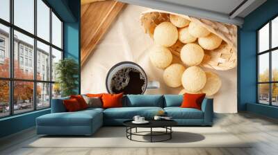 Cheese bread, breakfast table in Brazil, cheese bread, coffee and accessories, selective focus. Wall mural