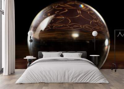 Crystal ball, scene with crystal ball and smoke, dark background. Selective focus. Wall mural