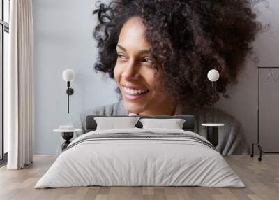 beautiful black woman smiling and looking away Wall mural