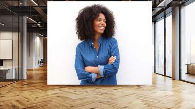 Beautiful happy black woman standing with arms crossed Wall mural