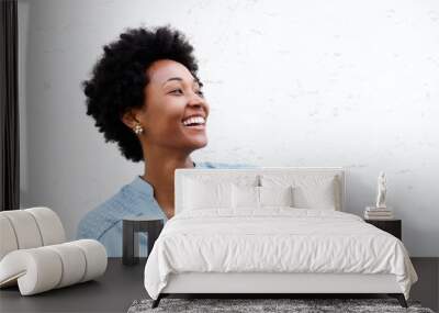 beautiful young black woman looking away and smiling Wall mural