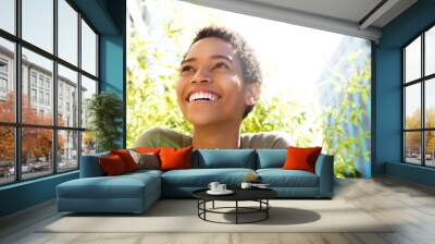 beautiful young black woman smiling outdoors Wall mural