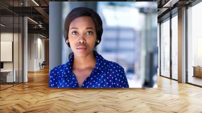 Business woman standing outside office building Wall mural