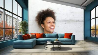 Carefree cheerful young african american woman Wall mural