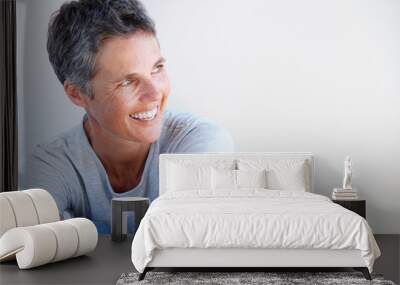 Close up beautiful older woman smiling against white background Wall mural