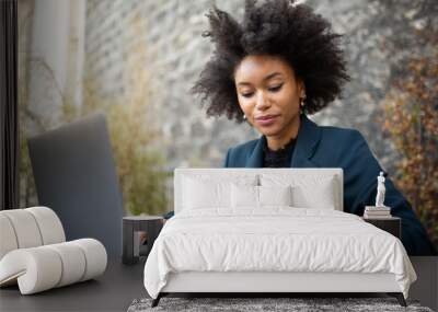 Close up businesswoman sitting with laptop computer and cellphone Wall mural