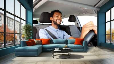 Close up happy african american man driving car Wall mural