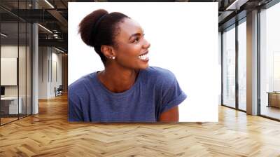 Close up happy young african woman smiling and looking away against isolated white background Wall mural