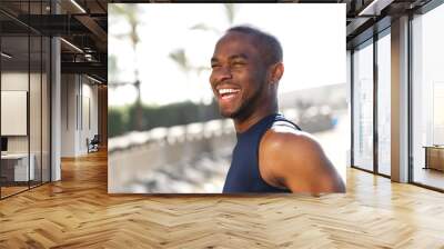 Close up happy young black man outdoors Wall mural