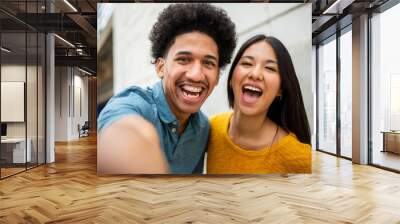 Close up happy young couple taking selfie together Wall mural