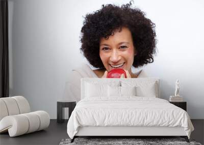 Close up healthy african american woman eating apple Wall mural