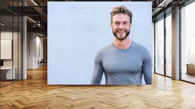 Close up portrait sports trainer smiling Wall mural