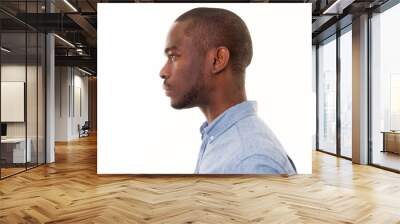 Close up profile of handsome young black man against isolated white background Wall mural