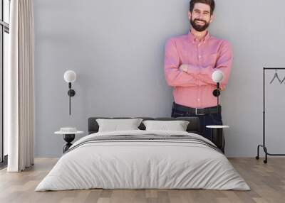 happy casual business man standing with arms crossed Wall mural