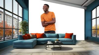 happy young black guy laughing with arms crossed against isolated white background Wall mural