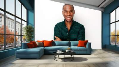 happy young black guy smiling with arms crossed against isolated white background Wall mural