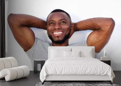 laughing muscular man standing isolated on white background Wall mural