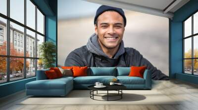 Portrait of handsome multi race man in winter wear Wall mural