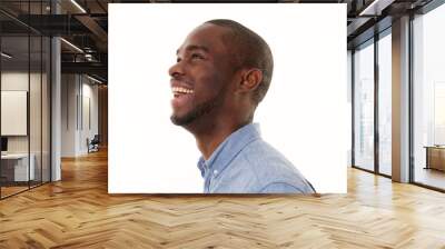 side portrait of laughing african american man looking up Wall mural