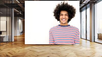 smiling young african american man with afro hair against isolated white background Wall mural