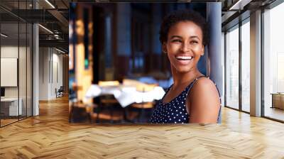 smiling young black woman standing outside Wall mural