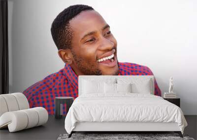 Smiling young man with checkered shirt Wall mural