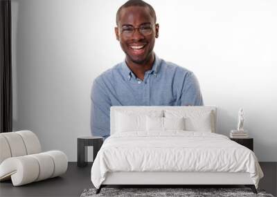 young african american businessman with glasses smiling with arms crossed against isolated white background Wall mural