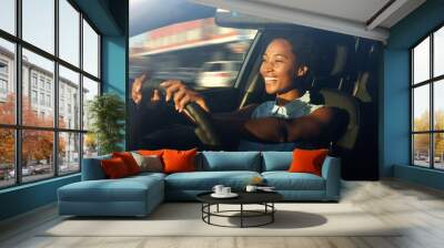 Young african american woman driving a car Wall mural