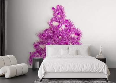 flatlay of christmas party with purple streamers in pine tree on white background, top view Wall mural