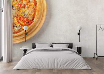 delicious pizza with chicken, mushrooms, cheese, tomatoes and corn on a concrete background Wall mural