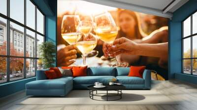 People clinking glasses with wine on the summer terrace of cafe or restaurant Wall mural