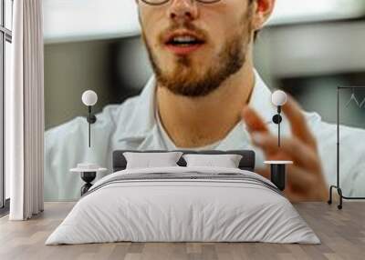 A young male scientist passionately explaining concepts in a laboratory environment, wearing glasses and a lab coat. Wall mural