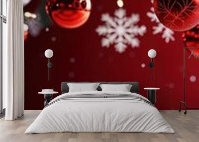 Festive red ornaments hang from a Christmas tree against a snowy backdrop, creating a warm holiday atmosphere. Wall mural