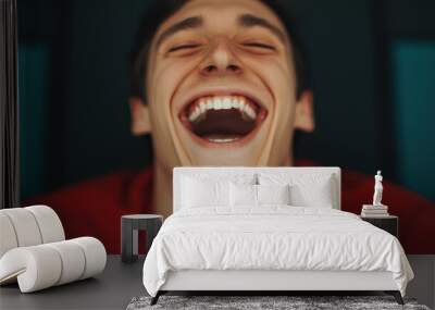 Joyful man laughing with an expressive smile, close-up shot. Wall mural