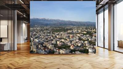 Panoramic aerial view from above of the city of Chania, Crete island, Greece with white mountains, beautiful venetian town Chania in Crete island. Chania, Crete, Greece. Wall mural