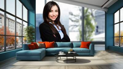 Beautiful businesswoman portrait in her office Wall mural