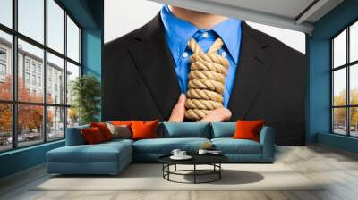 Businessman showing a loop knot instead of his necktie Wall mural