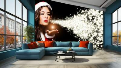 Christmas girl blowing shining snow flakes Wall mural