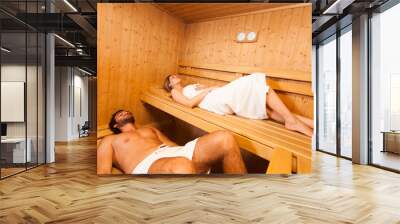 Couple relaxing in a sauna Wall mural