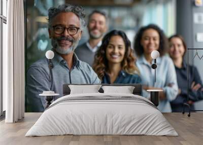 Diverse business team smiling with arms crossed in office Wall mural