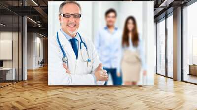 Doctor in front of a couple Wall mural