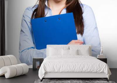 friendly businesswoman holding a clipboard isolated Wall mural