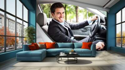 handsome man driving his car Wall mural