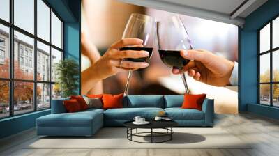 male and female hands toasting wine glasses. Wall mural