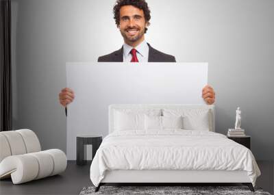 Man holding a blank board. Wall mural