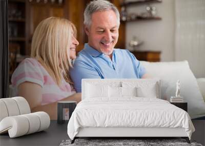 Mature couple using a digital tablet Wall mural