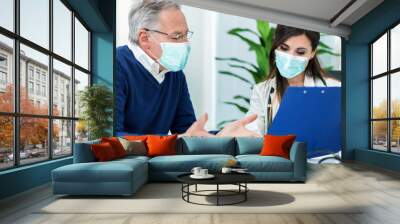 Patient talking to his doctor, covid concept Wall mural