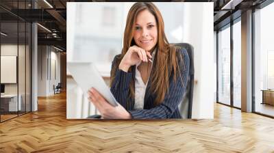 Portrait of a woman using a tablet Wall mural