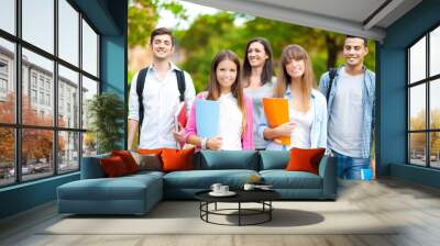 Smiling group of student at the park Wall mural