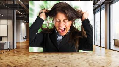 stressed businesswoman pulling her hair and yelling Wall mural